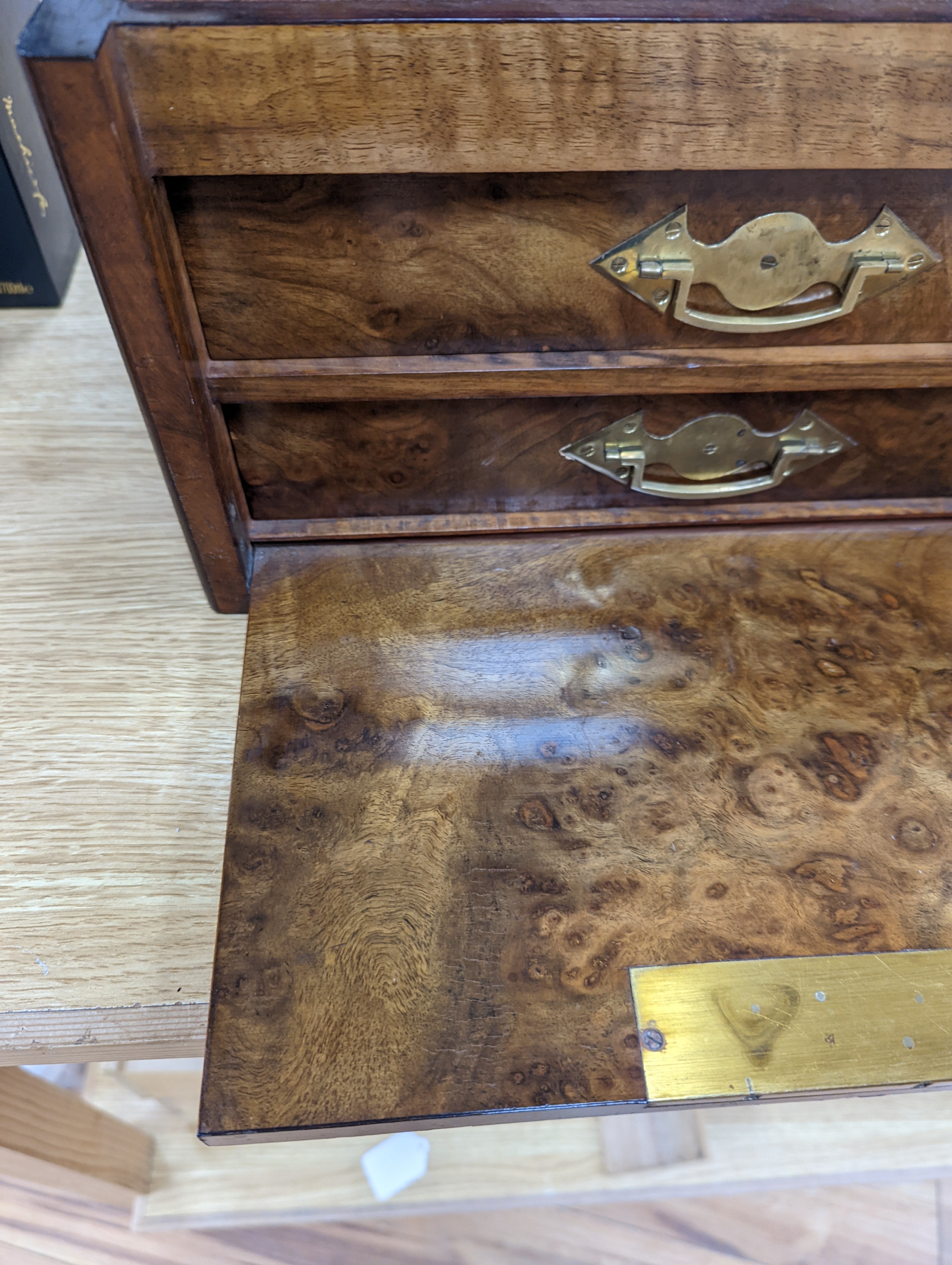 A Victorian walnut sewing casket, 34cm, containing sewing related accessories